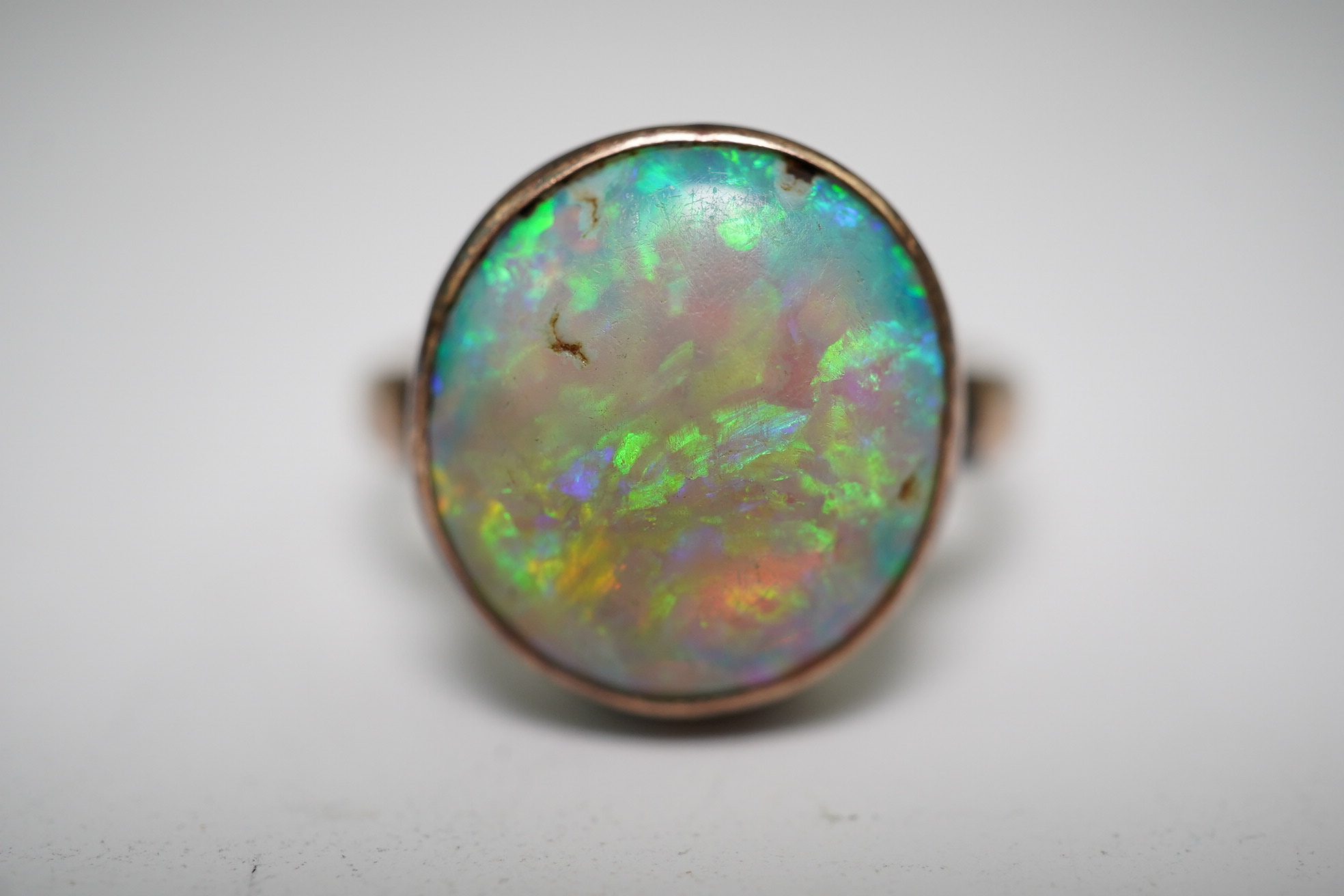 A 9ct gold opal dress ring, size J, gross weight 4.1 grams.